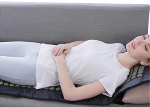 far infrared heating pad - woman laying on